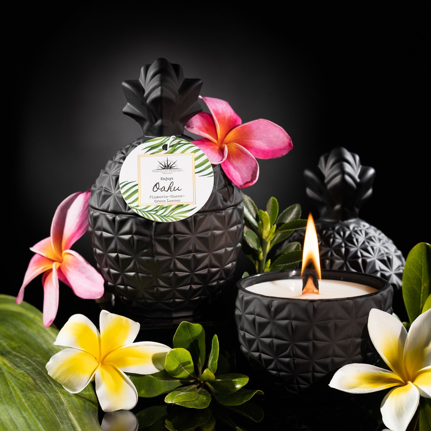 Candle in black pineapple jar scented with plumeria, guava and green leaves
