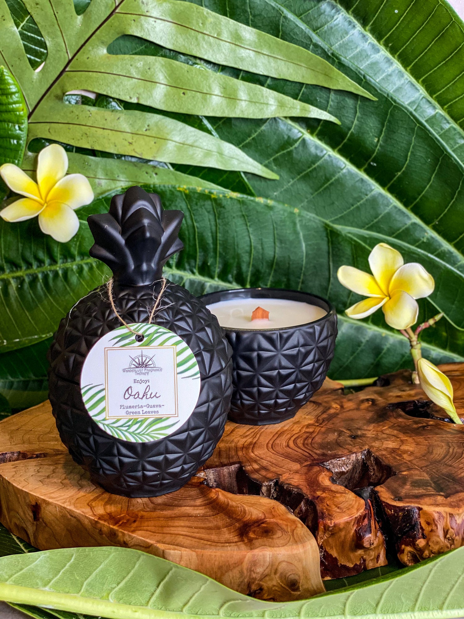 Candle in black pineapple jar scented with plumeria, guava and green leaves
